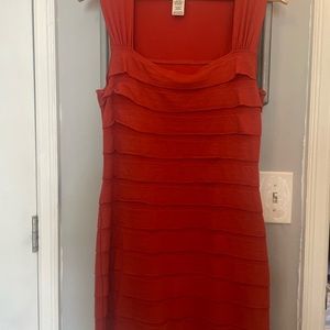 Cotton with a little spandex Burt orange.